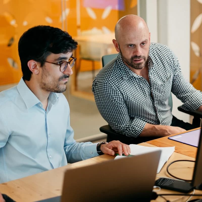 Colleagues talking together in an office